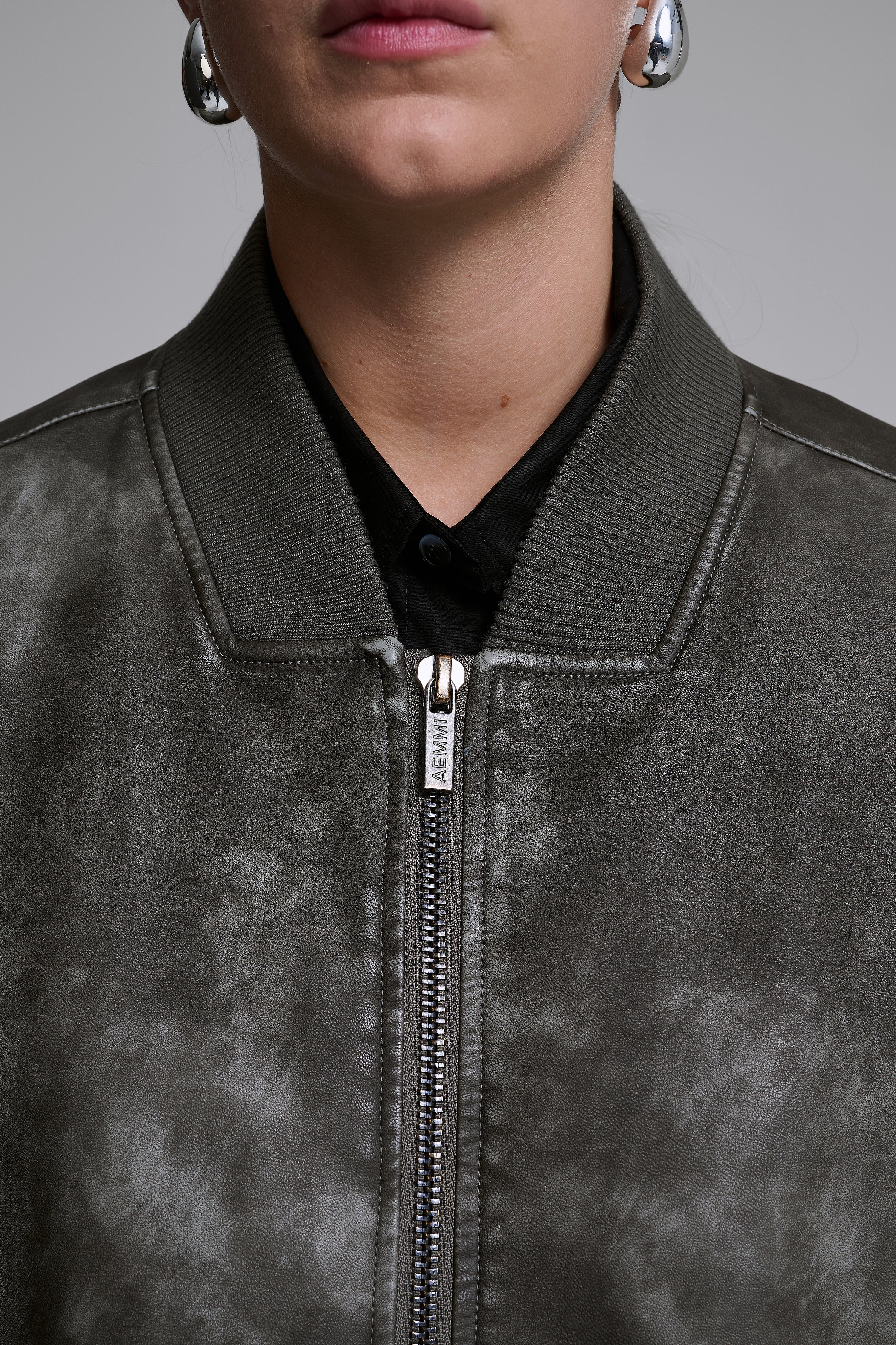 Grey washed faux leather bomber jacket by AEMMI